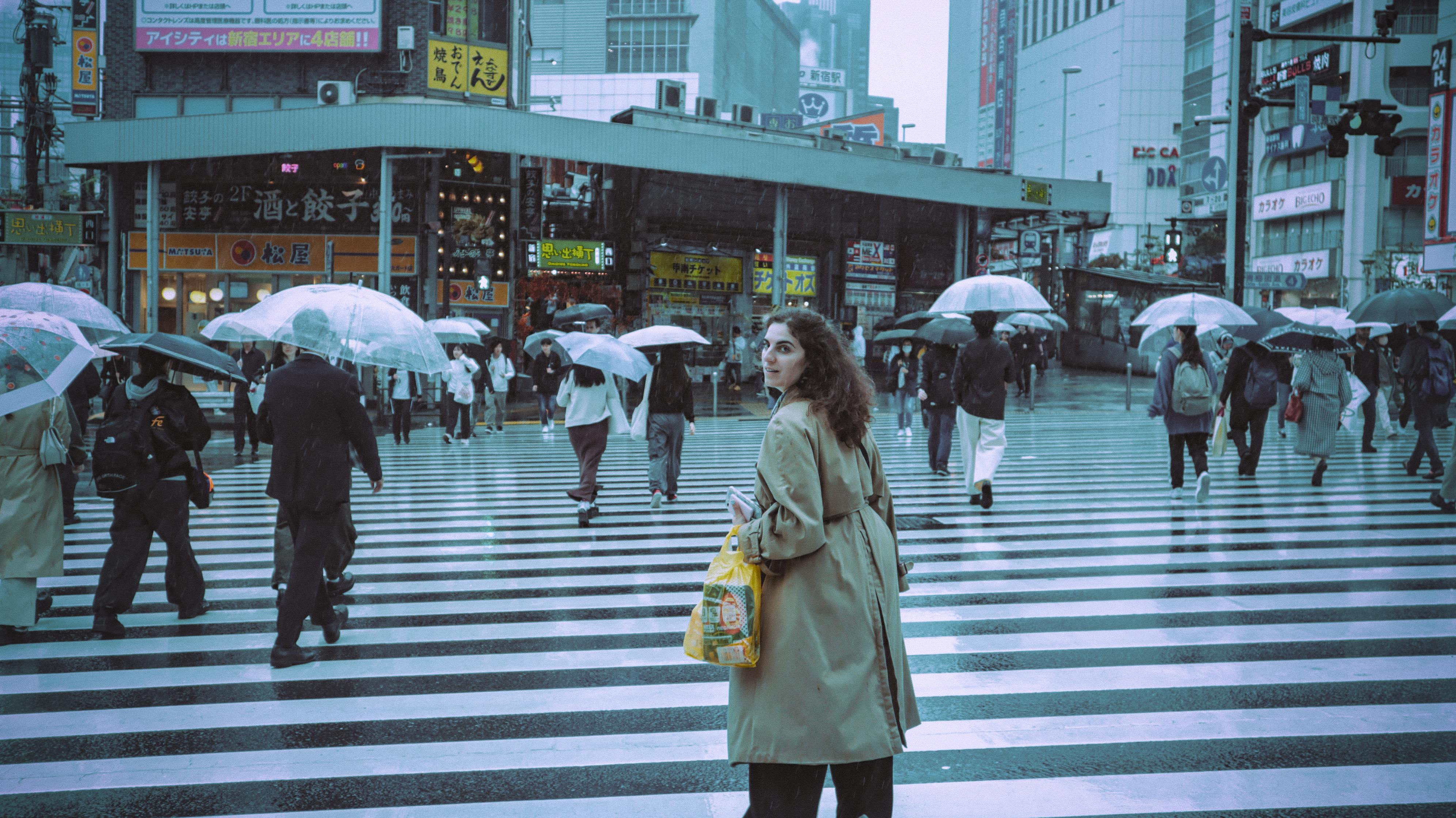 Woman at Shibuya crossing in the rain